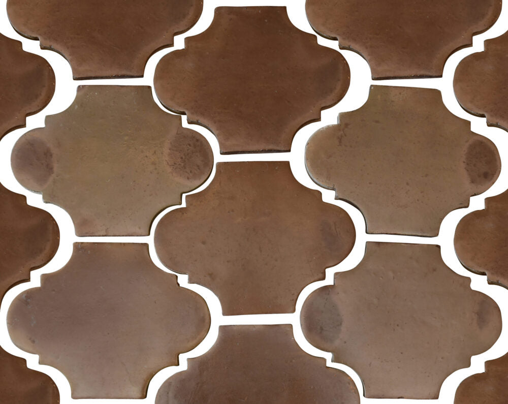 arabesque pattern in brown terracotta tile